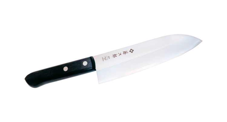 Нож Кухонный Сантоку  170 мм VG-10 3-слоя, 60-61HRC #5000 /TOJIRO Western Knife Нож Сантоку — универсальный японский нож. Santoku (三徳包丁) в переводе означает три добродетели: мясо, рыба и овощи. Этот нож подходит для работы в домашних условиях, для самых разнообразных манипуляций на кухне. Им можно чистить, нарезать, шинковать любые продукты и при этом получать несравнимое удовольствие. Ведь он создан с учётом эргономики и требований кулинаров к удобству и качеству инструмента.
Эргономичная рукоятка, широкое лезвие из стали, неприхотливость в уходе делают этот тип ножа одним из самых востребованных среди непрофессионалов. Купить японский нож Сантоку стоит всем, кто любит готовить дома. На профессиональной кухне он тоже будет кстати.

Японский кухонный нож Tojiro Western Knife — это великолепный кухонный инструмент, созданный из легендарной стали VG-10, которая прославилась на весь мир своей прочностью и непревзойдёнными режущими качествами. Компания Takefu разработала стандарт качества закалки металла 61 HRC, который стал эталоном в поварских инструментах. Нож полностью защищён от коррозии и укреплён дополнительными металлическими пластинами прочности. Заточка линейки симметричная и тончайшая, что позволяет резать продукты легко и быстро.

Купить набор хороших кухонных ножей Tojiro этой линейки можно не только для специализированного, но и домашнего применения. Ножи Western Knife используют профессиональные повара по всему миру. Рукоять буквально сливается с рукой, а процесс приготовления становится простым и интересным занятием. Приятный бонус для такого инструмента — доступная цена.

Элементы ножа, выполненные не из стали, защищены от всевозможных губительных воздействий, включая моющую химию. Модель не капризная в уходе и легко моется. Благодаря красивой упаковочной коробке, может стать приятным подарком профессиональному повару или опытному любителю кулинарного искусства.

Не рекомендуем мыть в посудомоечной машине.

Серия: Western Knife
Тип товара: Нож Сантоку
Артикул: F-301
Материал лезвия: VG10 + 13 Chrome Stainless Steel
Слои лезвия: 3
Материал рукояти: Стабилизированная древесина
Длина лезвия, см: 17
Длина ножа. мм: 290
Твердость лезвия (HRC): 60-61
Заточка: #5000
Вес, кг: 0,175
Объем, м³: 0,00055594
Размер упаковки: 380*77*19
Толщина обуха: 1,70
